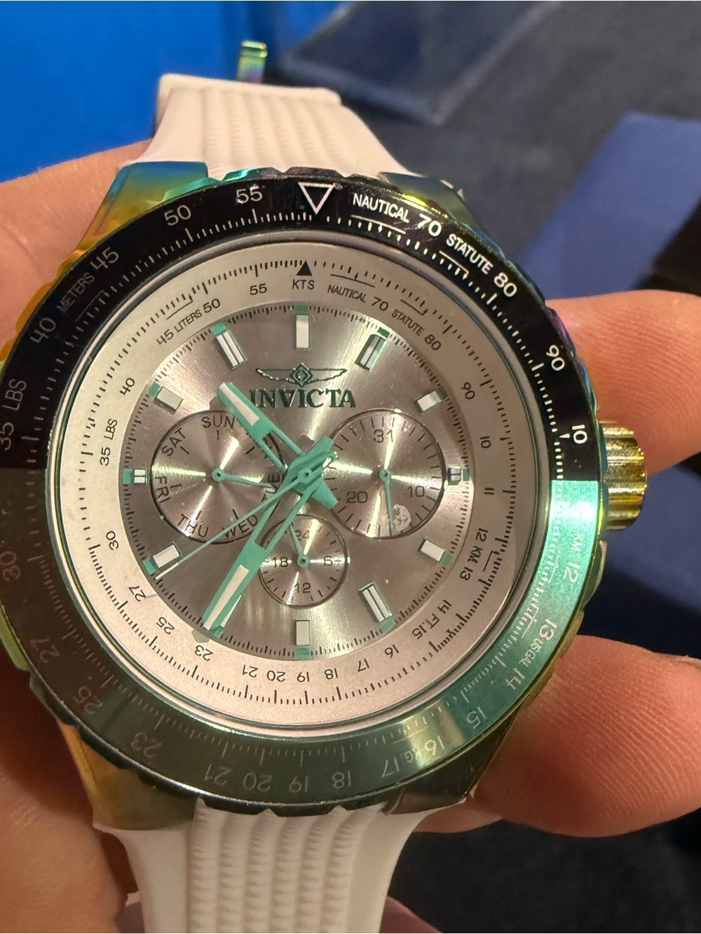 Invicta Silver Dial Watch with Green Accent and White Strap